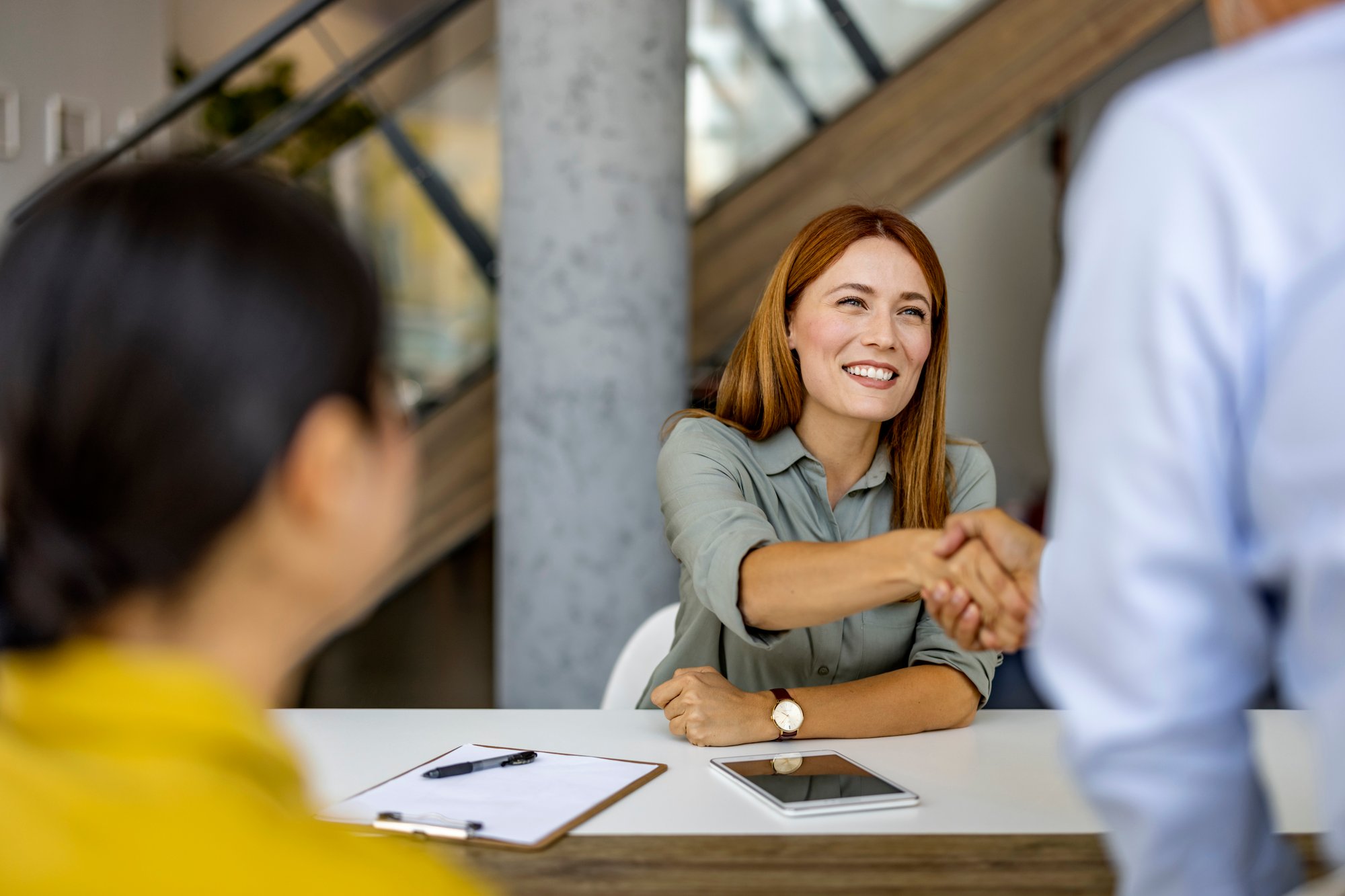 a woman shaking hands a woman shaking hands