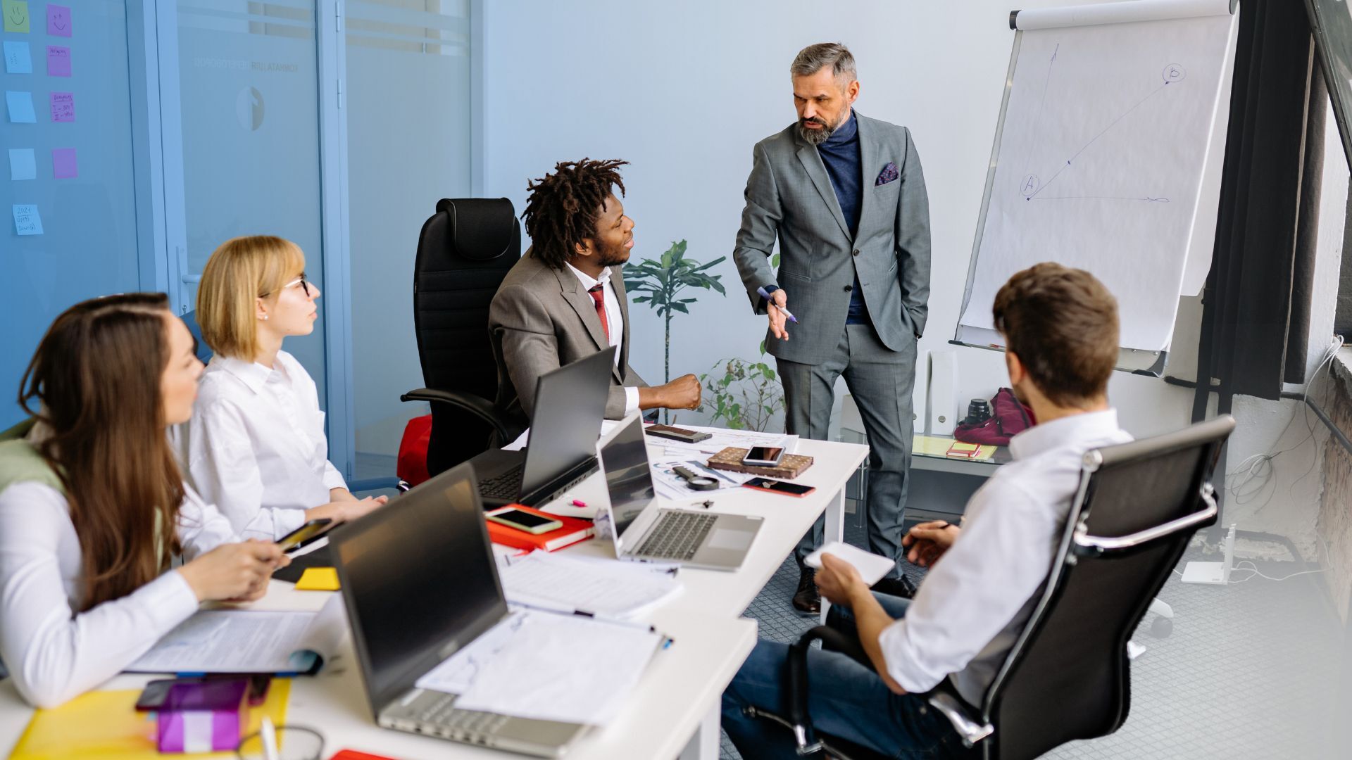 Group of people in a meeting around a table