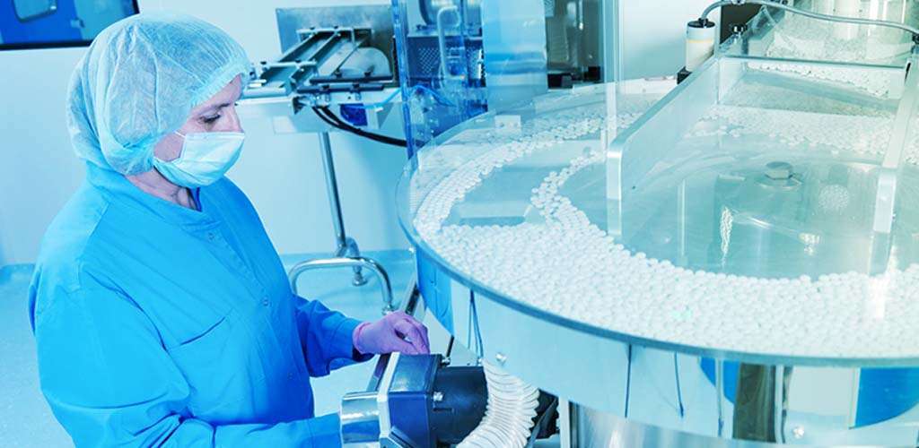 A pharmaceutical woman checking drugs in a laboratory.